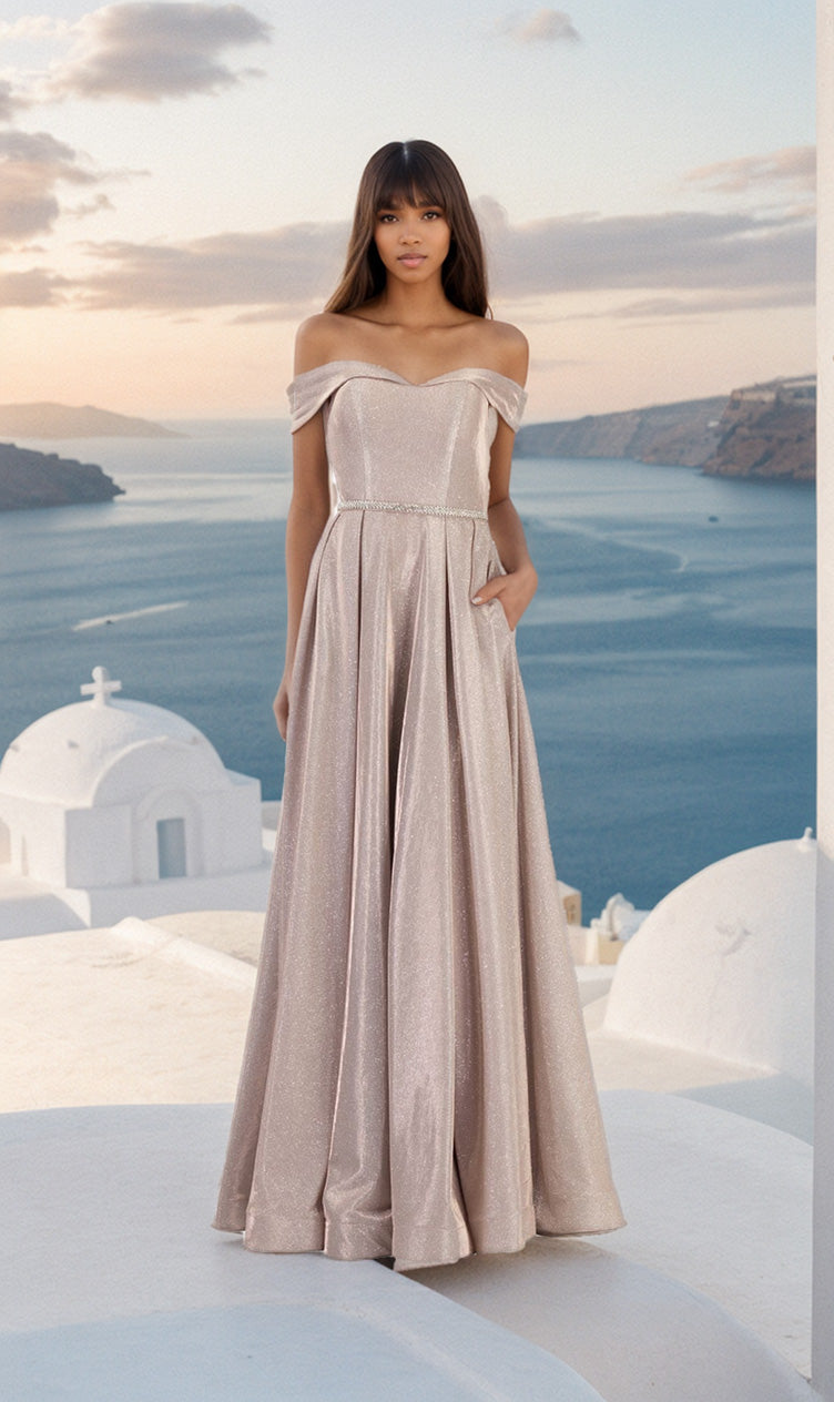 A woman in the Long Glitter A-Line Prom Dress: Chicas DM4007 stands on a white rooftop with the blue sea and sky behind her, likely in Santorini, Greece.